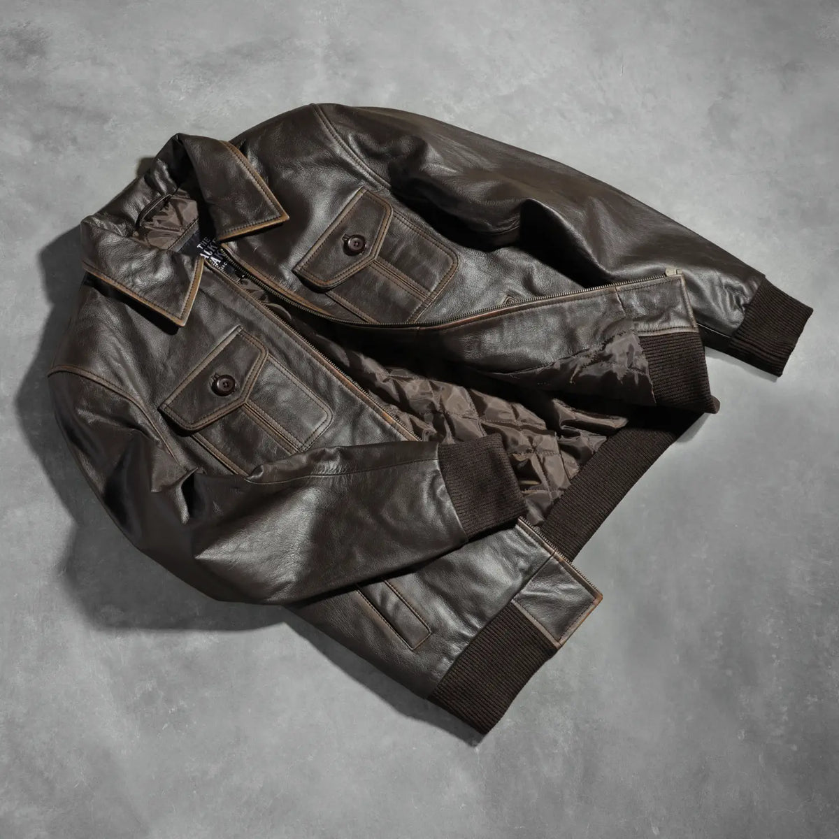 
Knit Rib & Hem Craftsmanship Construction Detail on Aaron Distressed Brown Leather Bomber Jacket