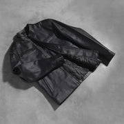 Styled Fit Perspective of Austere Matte Schwarz Leder-Bikerjacke für Herren on Model - Natural Daylight Drape