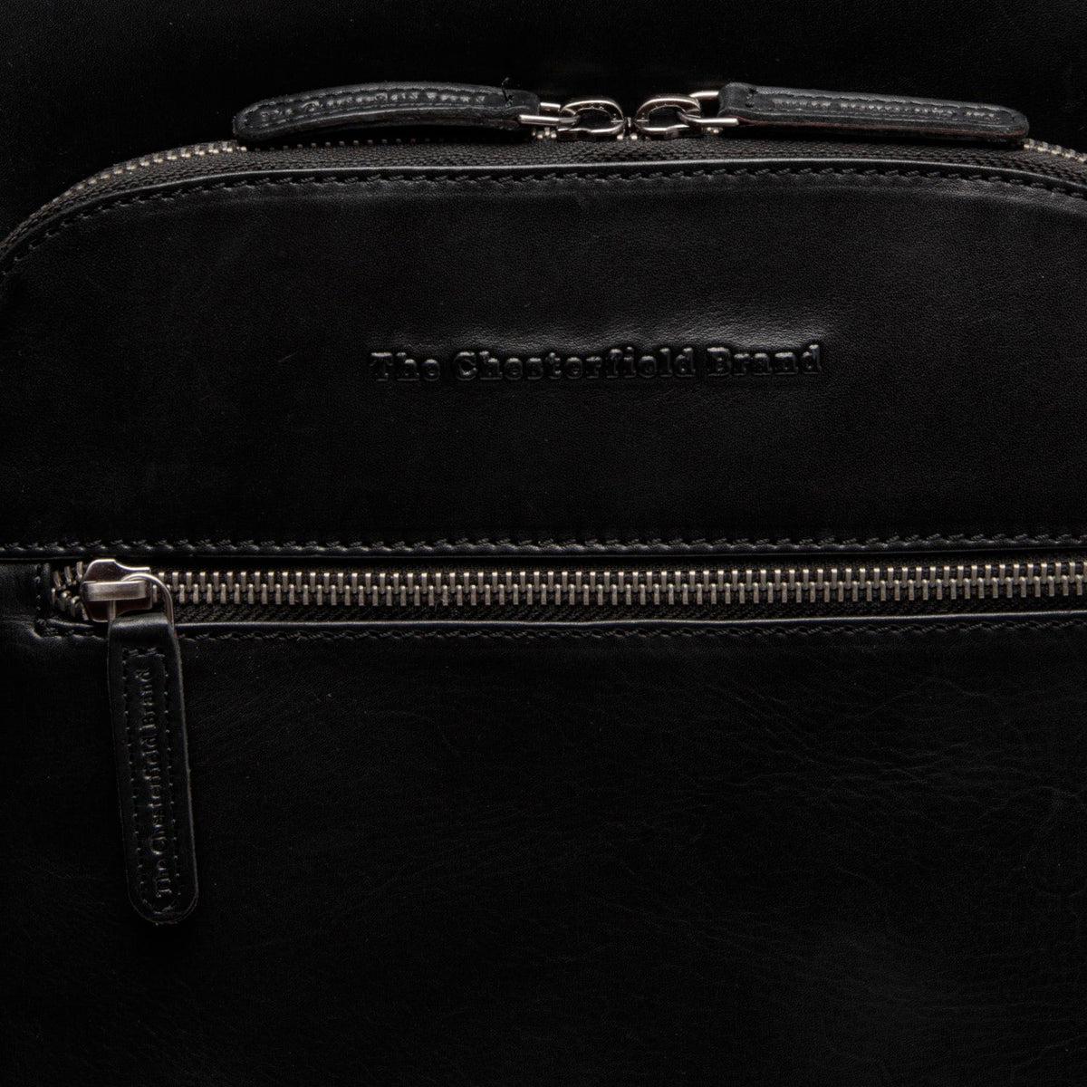Solid Antique Brass Hardware & Heavy-Duty Dual Zipper Detail on Maggiore Full-Grain Leather Laptop Backpack